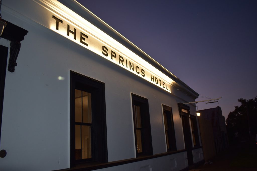 The Springs Hotel facade at night