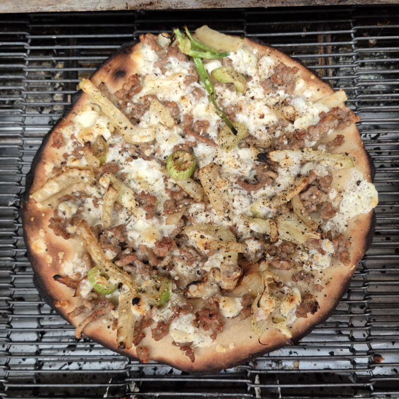 pork and fennel pizza on oven grill
