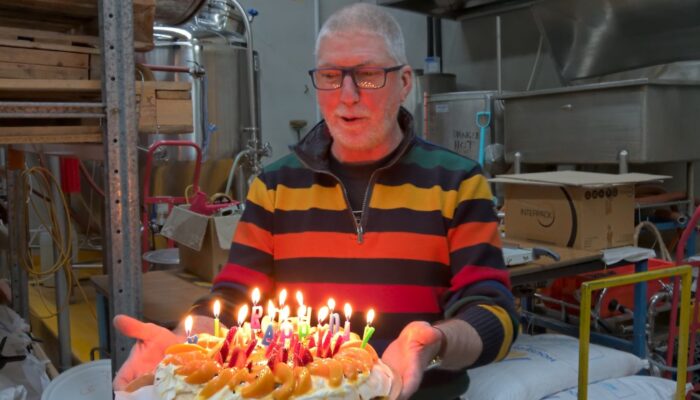 Malcolm with a pavlova birthday cake